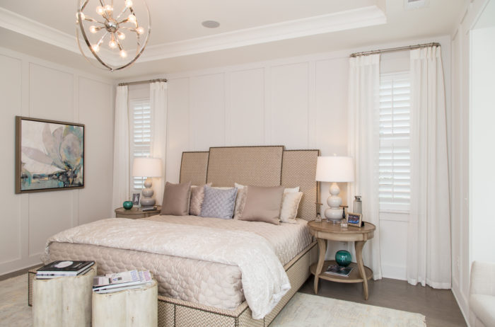 Guest bedroom with plantation shutters and curtains
